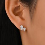 Oorbellen met 3 pootjes en dubbele peervormige Moissanite-steen.