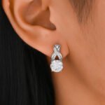 Orecchini a cerchio in moissanite intrecciati per l'eternità