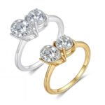 Pear and round two stone moissanite engagement ring 3 خاتم خطوبة من حجرين من المويسانايت، أحدهما على شكل كمثرى والآخر دائري.
