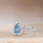Halo setting pear cut lab grown blue diamond engagment ring