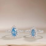 Halo setting pear cut lab grown blue diamond engagment ring