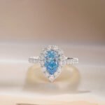 Halo setting pear cut lab grown blue diamond engagment ring