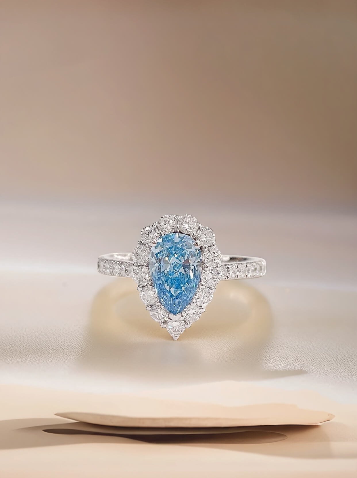 Halo setting pear cut lab grown blue diamond engagment ring