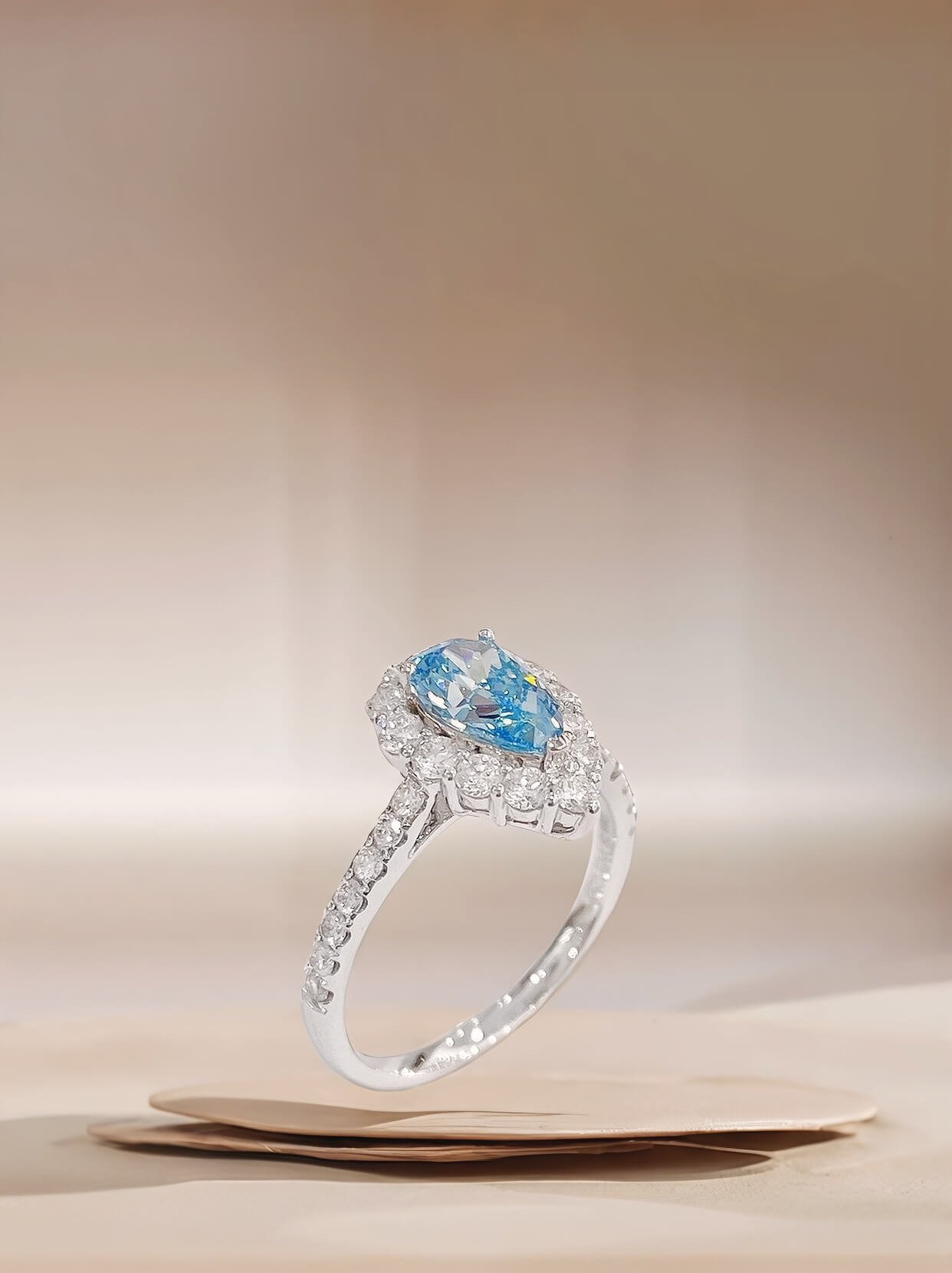 Halo setting pear cut lab grown blue diamond engagment ring