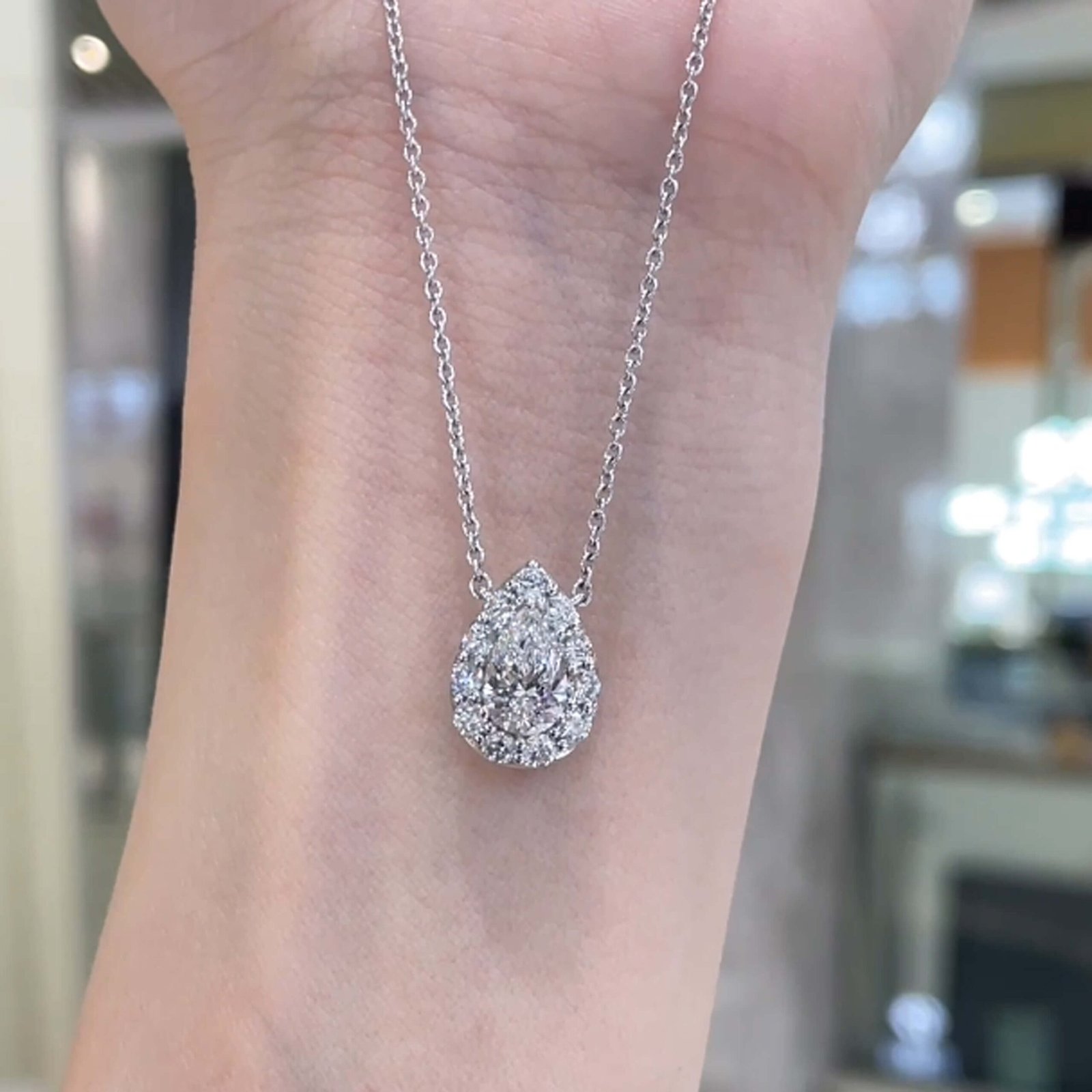 Halo setting pear cut lab grown diamond pendant necklace Halo setting pear cut lab grown diamond pendant necklace