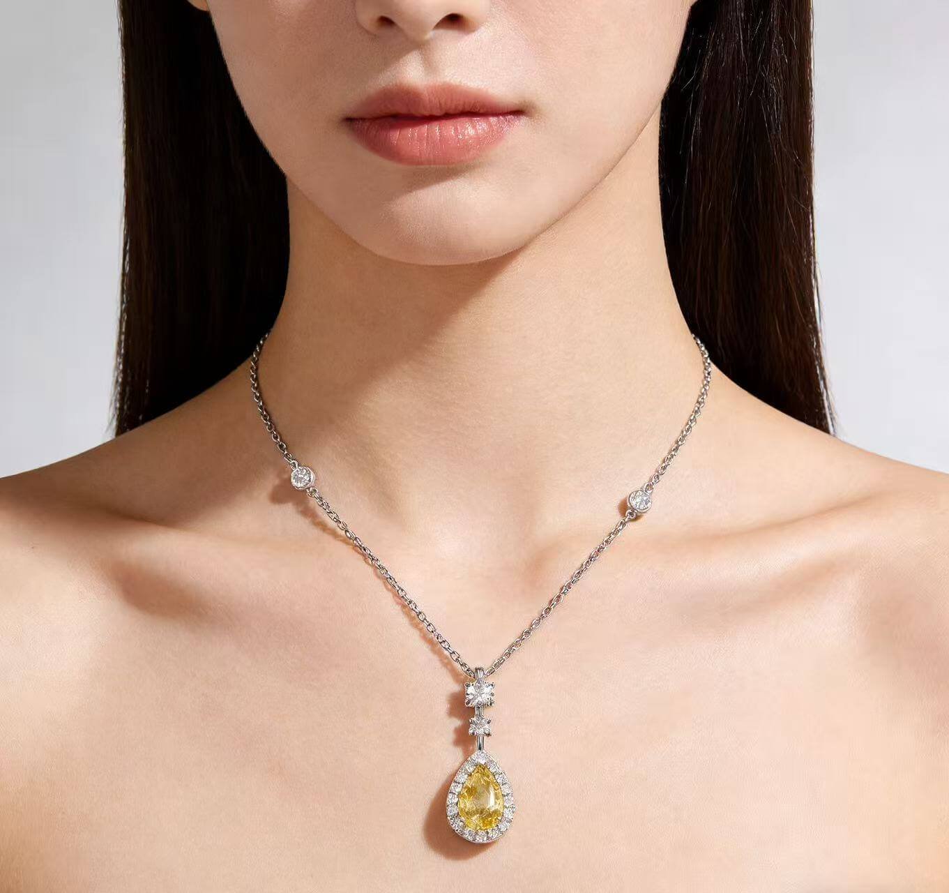 Halo setting pear cut lab grown yellow diamond necklace