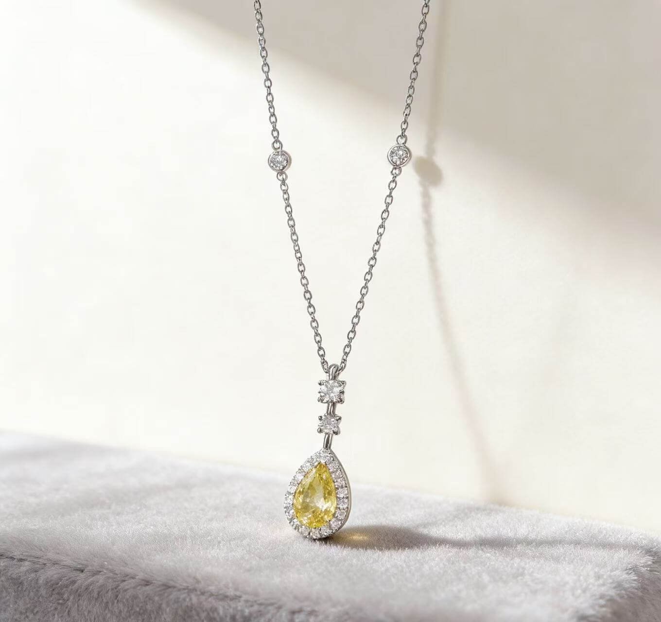 Halo setting pear cut lab grown yellow diamond necklace