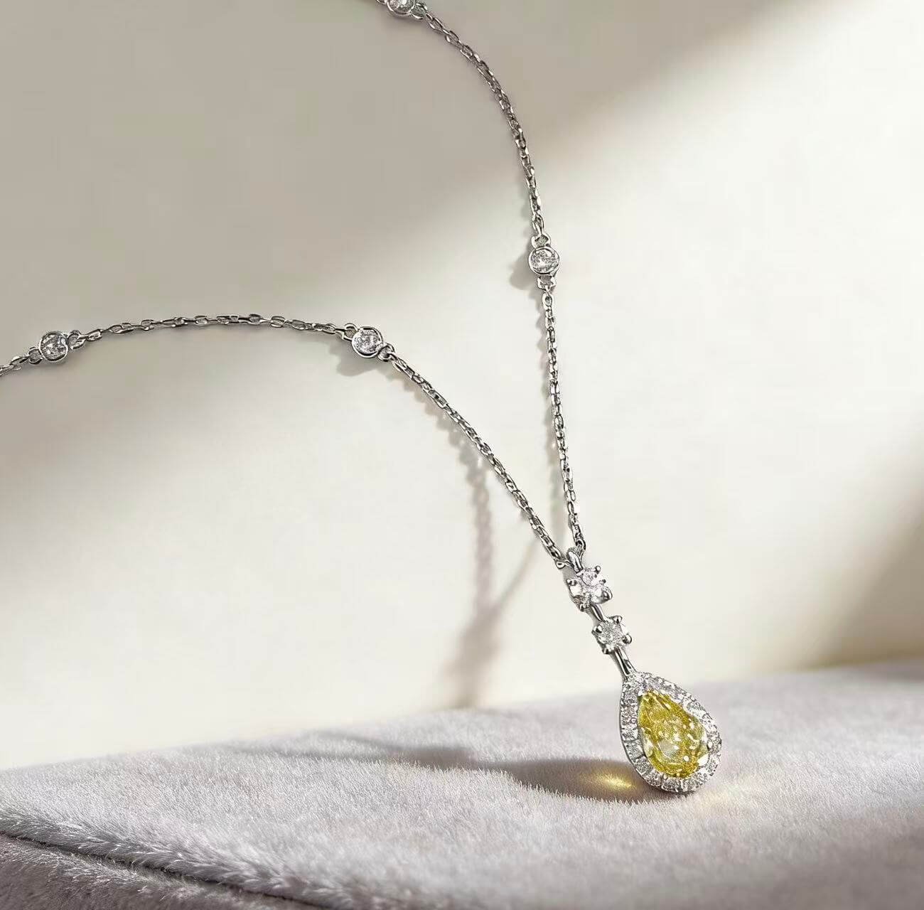 Halo setting pear cut lab grown yellow diamond necklace