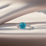 Cushion cut lab grown Paraiba engagement ring