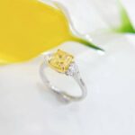 Cushion cut lab grown yellow diamond three stones engagement ring
