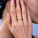 Cushion cut lab grown yellow diamond three stones engagement ring