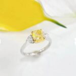 Cushion cut lab grown yellow diamond three stones engagement ring