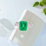 Emerald cut lab grown emerald three stones engagement ring 01