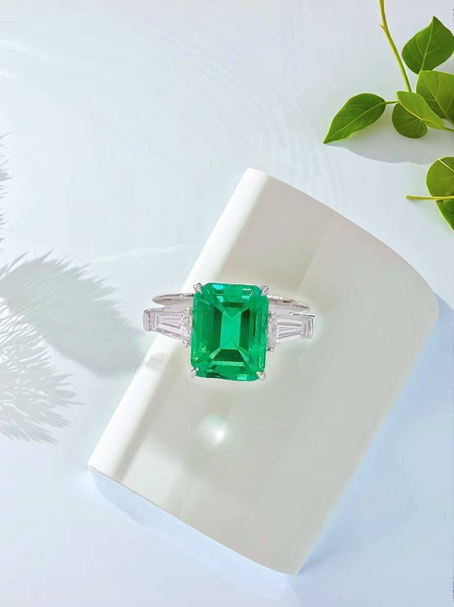 Emerald cut lab grown emerald three stones engagement ring 01