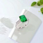 Emerald cut lab grown emerald three stones engagement ring 01