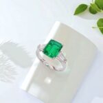 Emerald cut lab grown emerald three stones engagement ring 01