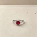 Halo setting cushion cut lab grown ruby engagement ring