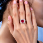 Halo setting cushion cut lab grown ruby engagement ring