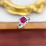 Halo setting cushion cut lab grown ruby engagement ring