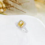 Halo setting cushion cut lab grown yellow diamond engagement ring