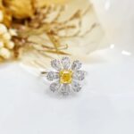 Halo setting cushion cut lab grown yellow diamond engagement ring