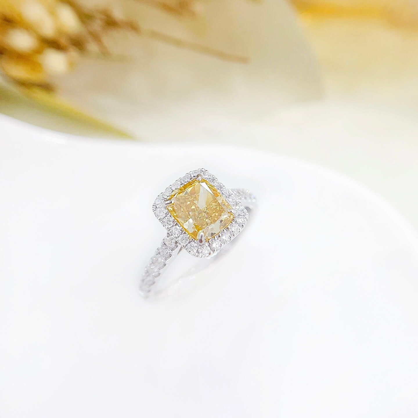 Halo setting cushion cut lab grown yellow diamond engagement ring