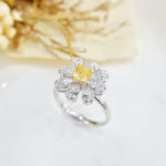 Halo setting cushion cut lab grown yellow diamond engagement ring