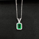 Halo setting emerald cut lab grown emerald pendant necklace 01