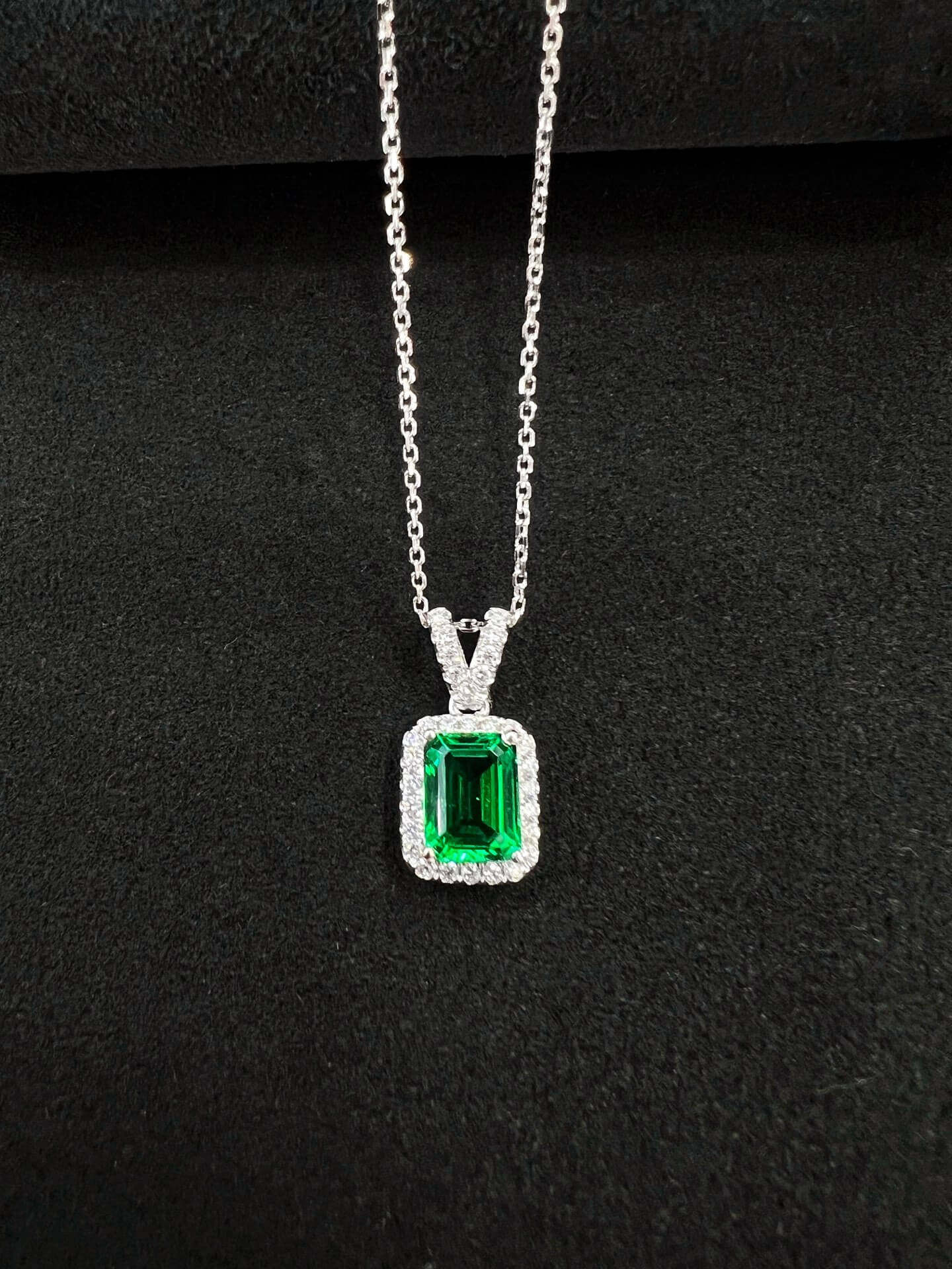 Halo setting emerald cut lab grown emerald pendant necklace 01