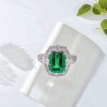 Halo setting lab grown emerald engagement ring