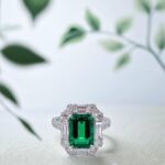 Halo setting lab grown emerald engagement ring