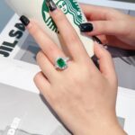 Halo setting lab grown emerald engagement ring