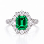 Halo setting lab grown emerald engagement ring