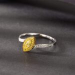 Halo setting marquise cut lab grown yellow diamond engagement ring