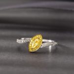 Halo setting marquise cut lab grown yellow diamond engagement ring