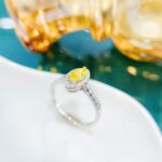 Halo setting marquise cut lab grown yellow diamond engagement ring