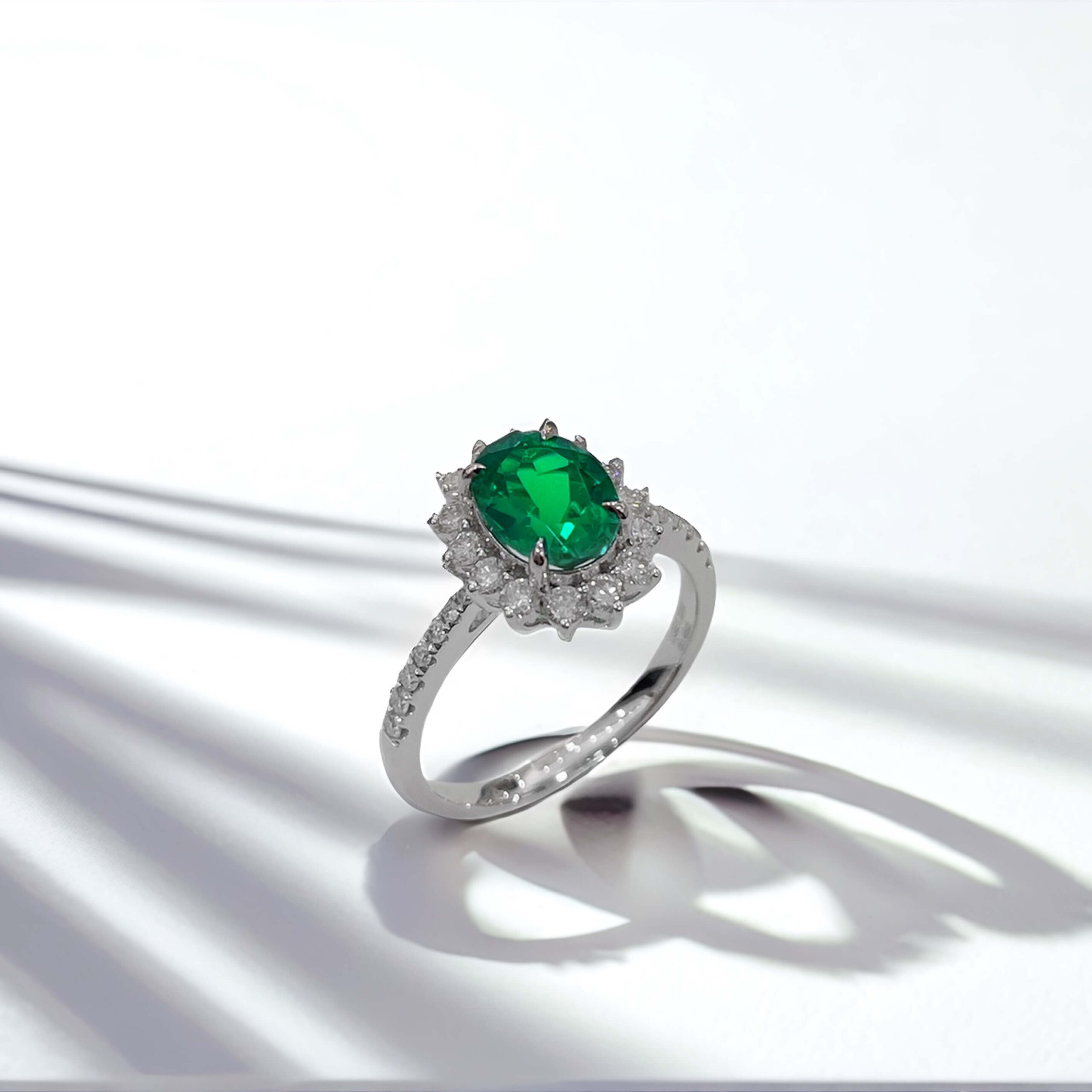 Halo setting oval cut lab grown emerald engagement ring 02 Halo setting oval cut lab grown emerald engagement ring 02