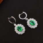 Halo setting oval cut lab grown emerald hoop earrings