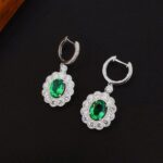 Halo setting oval cut lab grown emerald hoop earrings