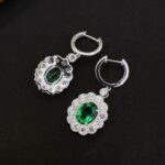 Halo setting oval cut lab grown emerald hoop earrings