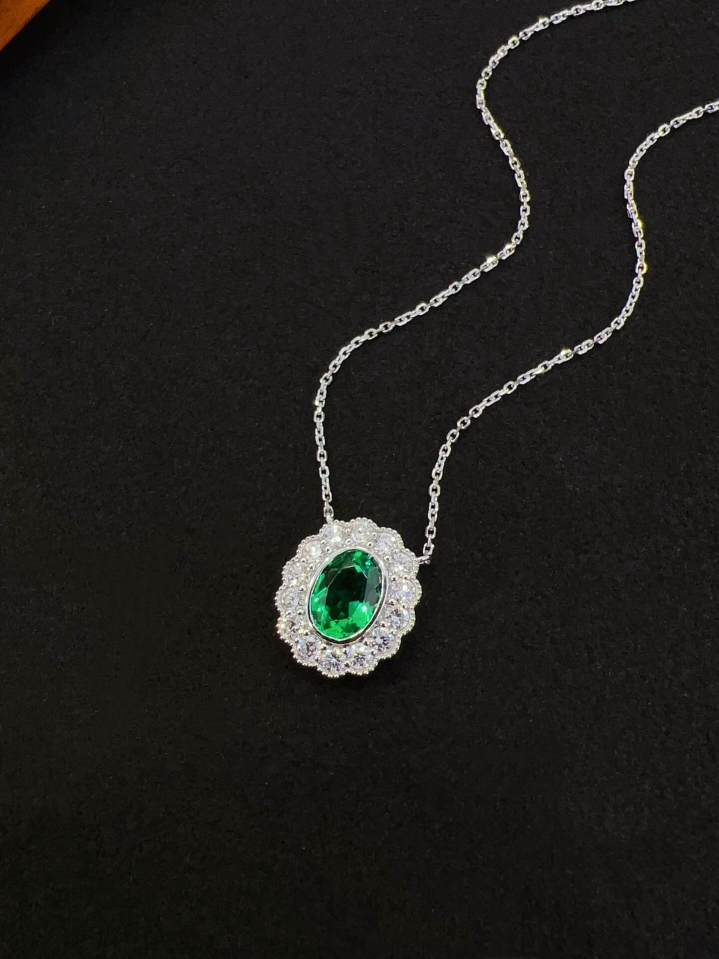 Halo setting oval cut lab grown emerald pendant necklace 01