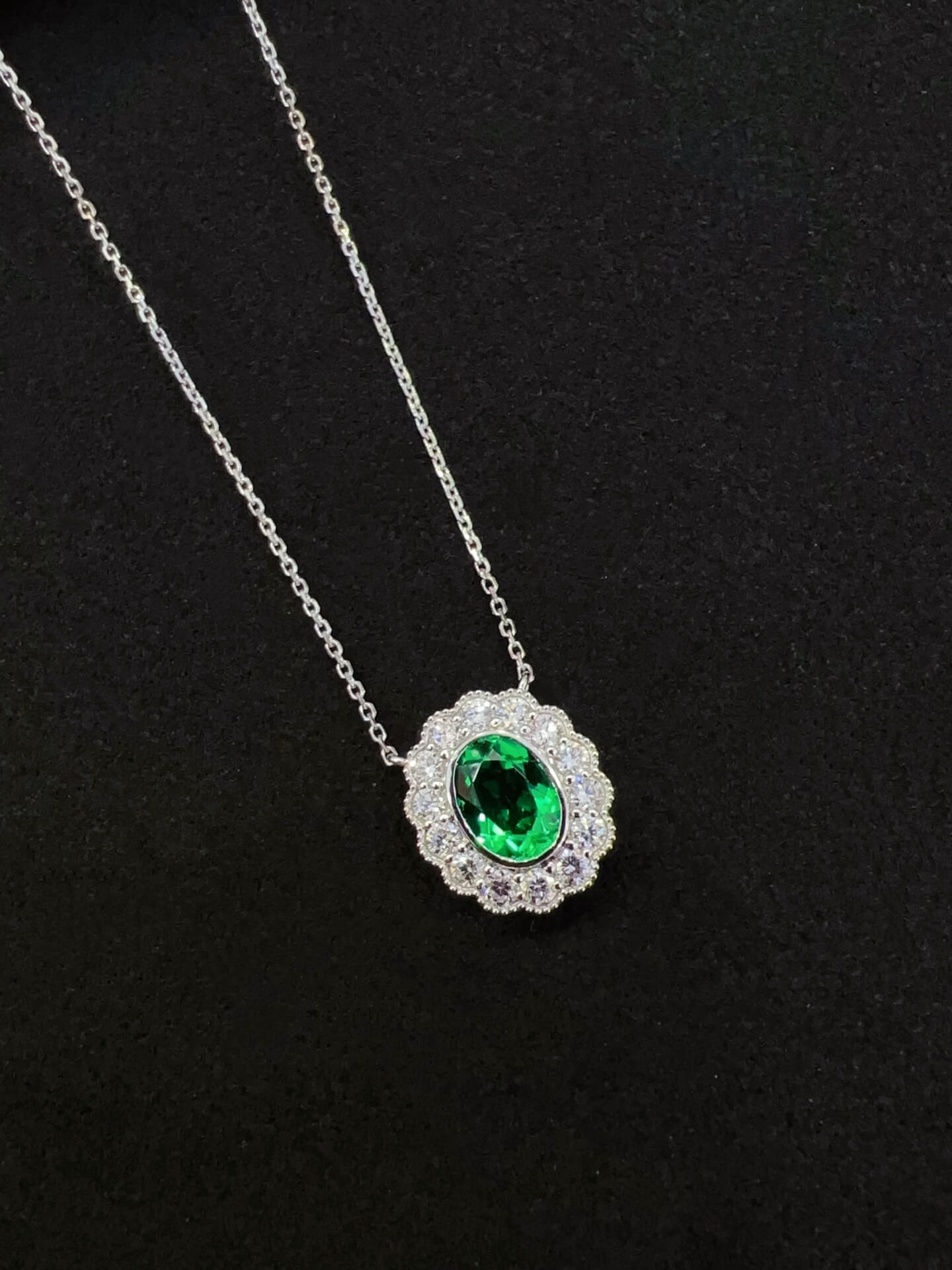 Halo setting oval cut lab grown emerald pendant necklace 01
