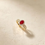 Halo setting oval cut lab grown ruby engagement ring