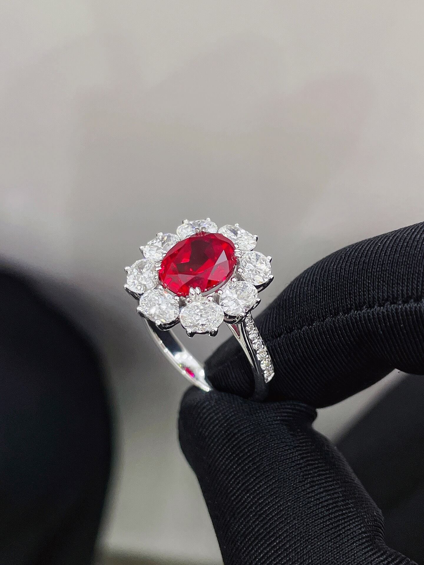 Halo setting oval cut lab grown ruby engagement ring Halo setting oval cut lab grown ruby engagement ring
