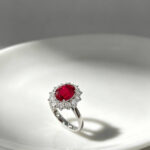 Halo setting oval cut lab grown ruby engagement ring