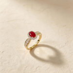 Halo setting oval cut lab grown ruby engagement ring