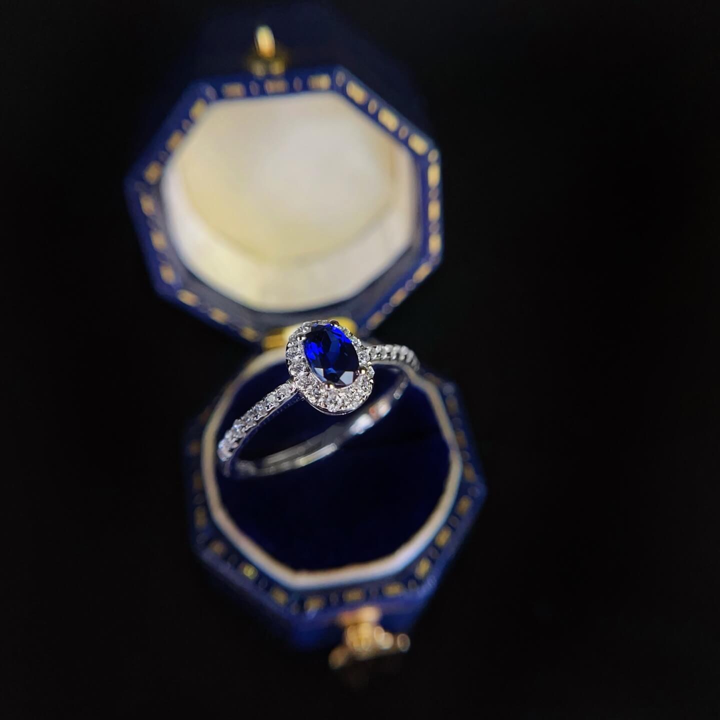 Halo setting oval cut lab grown sapphire engagement ring 01