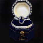 Halo setting oval cut lab grown sapphire engagement ring 01