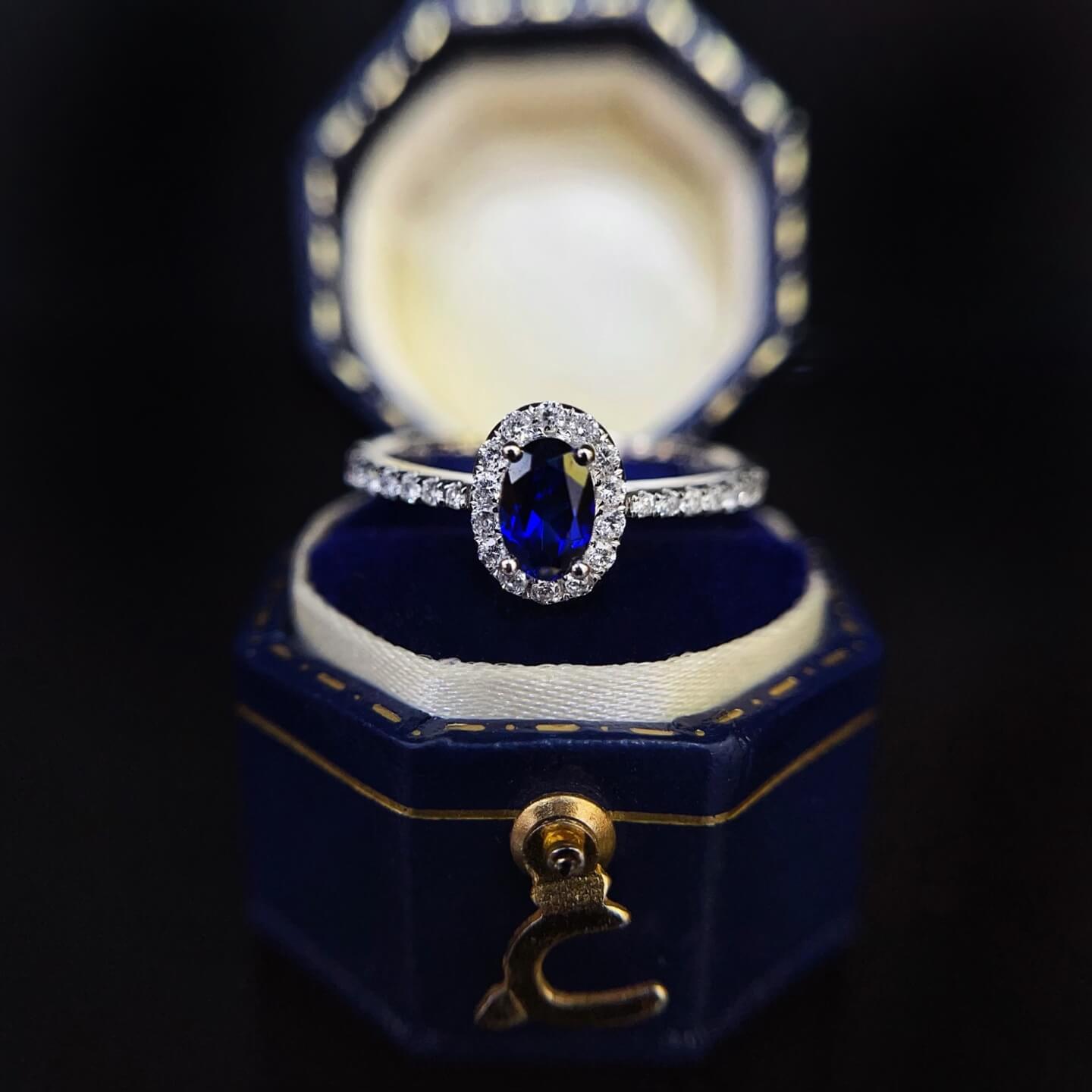 Halo setting oval cut lab grown sapphire engagement ring 01