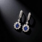 Halo setting oval cut lab grown sapphire hoop earrings